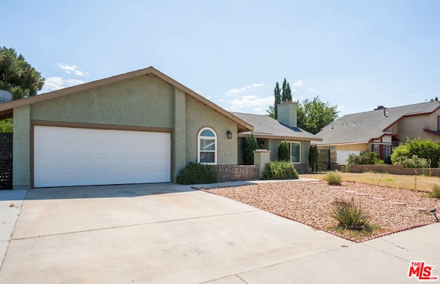 single story home featuring a garage