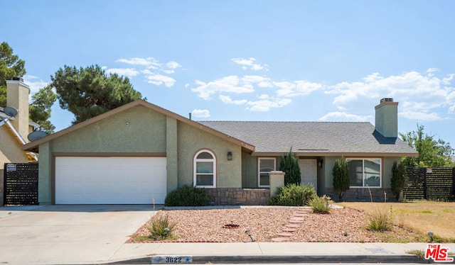 ranch-style house featuring a garage