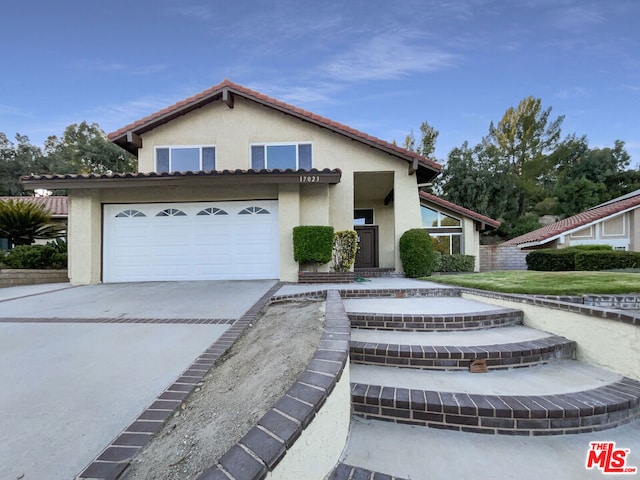 view of front of property with a garage