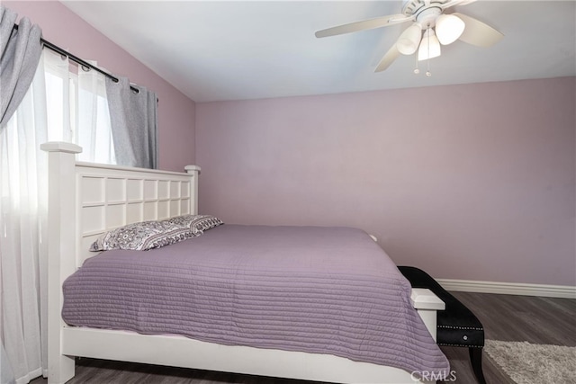 bedroom featuring ceiling fan and dark hardwood / wood-style flooring