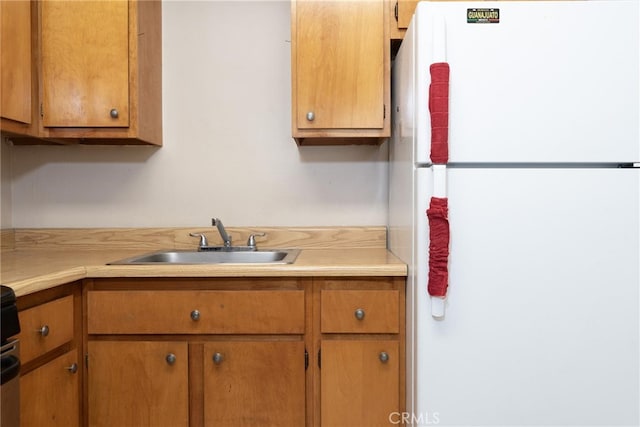 kitchen with white fridge and sink