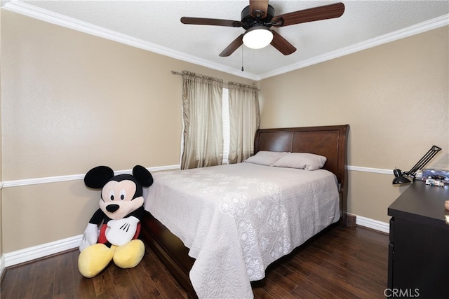 bedroom featuring a textured ceiling, dark hardwood / wood-style floors, ceiling fan, and crown molding