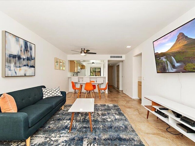 living room featuring ceiling fan