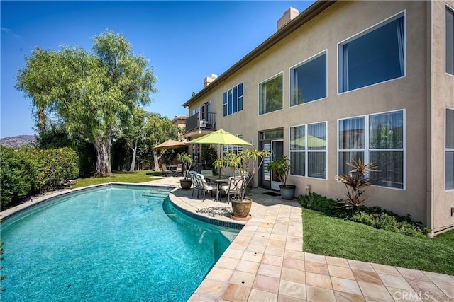 view of pool featuring a patio