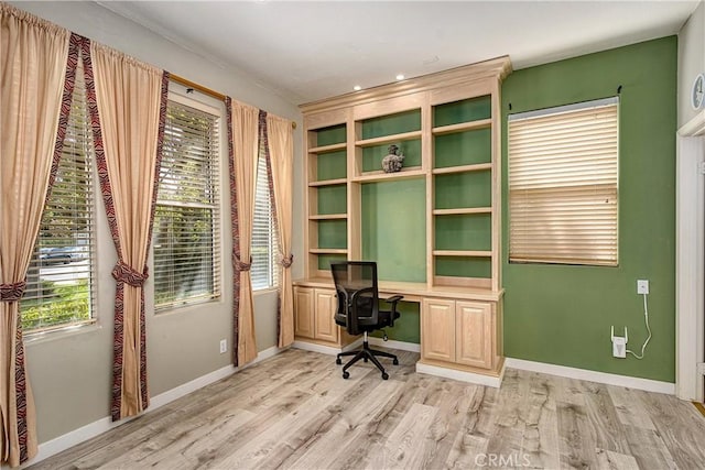 unfurnished office featuring light hardwood / wood-style floors