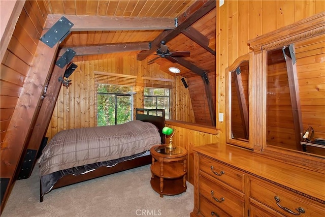 bedroom with lofted ceiling with beams, wood ceiling, wooden walls, and carpet