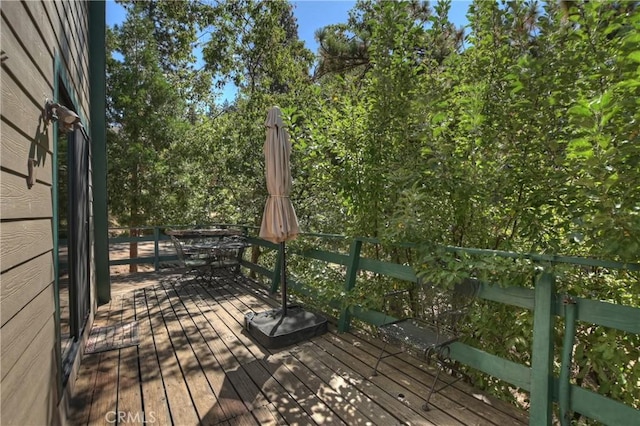 wooden deck with outdoor dining area