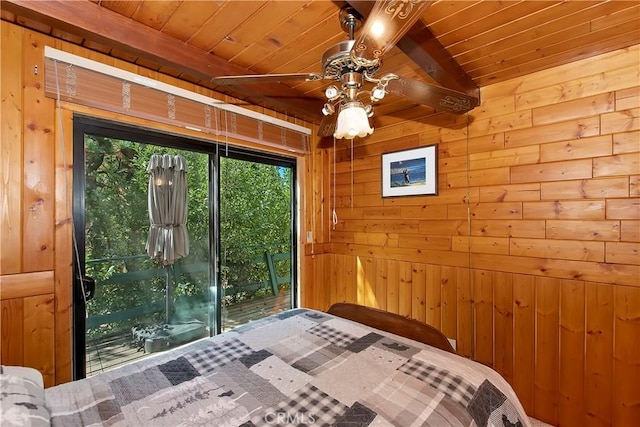 bedroom featuring wooden walls, beamed ceiling, and wood ceiling