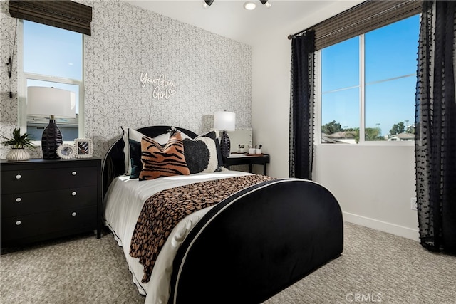 bedroom with light colored carpet