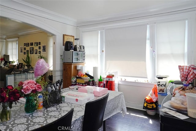 dining room featuring crown molding