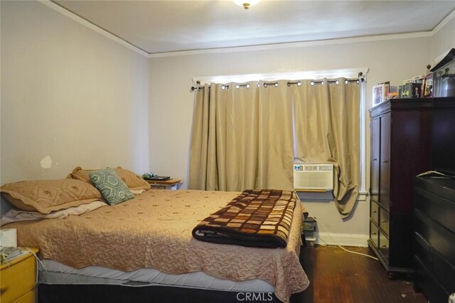 bedroom featuring cooling unit, crown molding, and dark hardwood / wood-style flooring