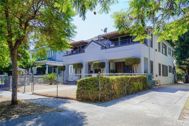 view of front of property with a balcony