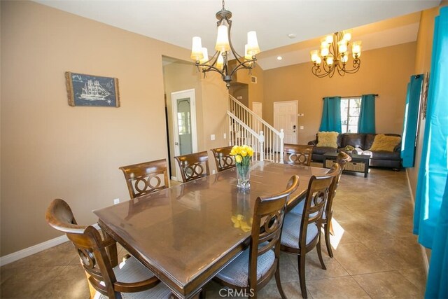 dining space featuring an inviting chandelier and tile patterned floors