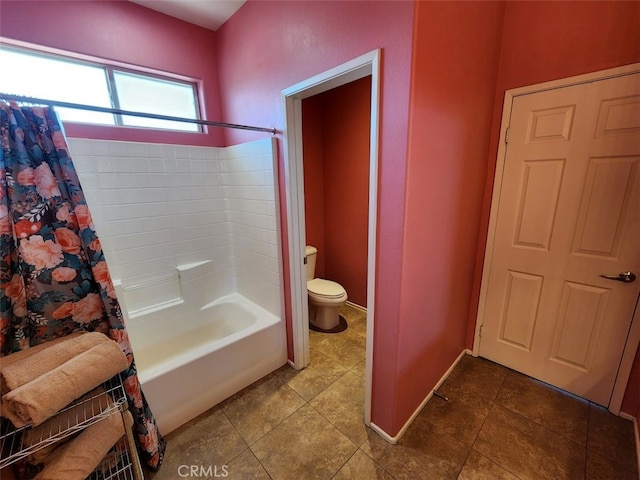 bathroom featuring tile patterned floors, toilet, and shower / tub combo with curtain