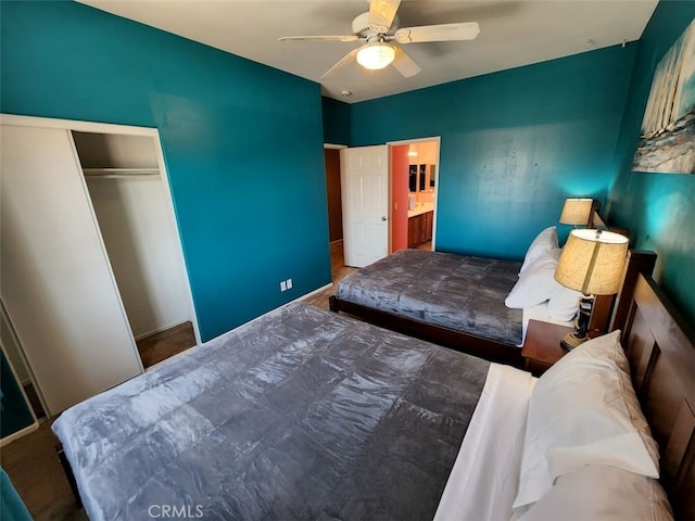 bedroom featuring ceiling fan and a closet