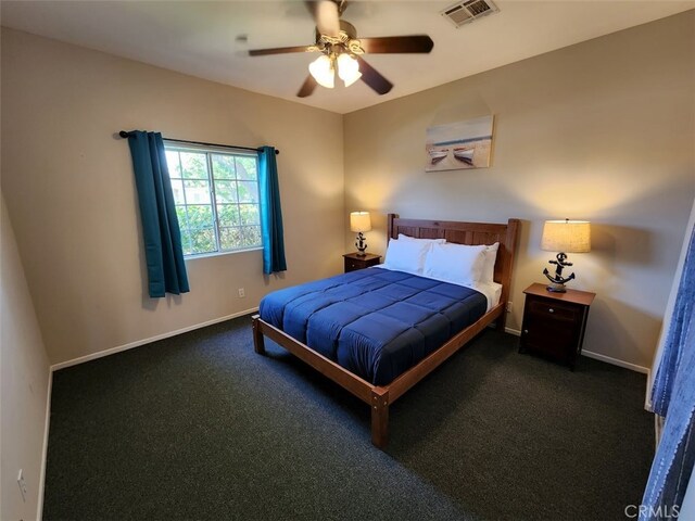 bedroom featuring dark colored carpet and ceiling fan