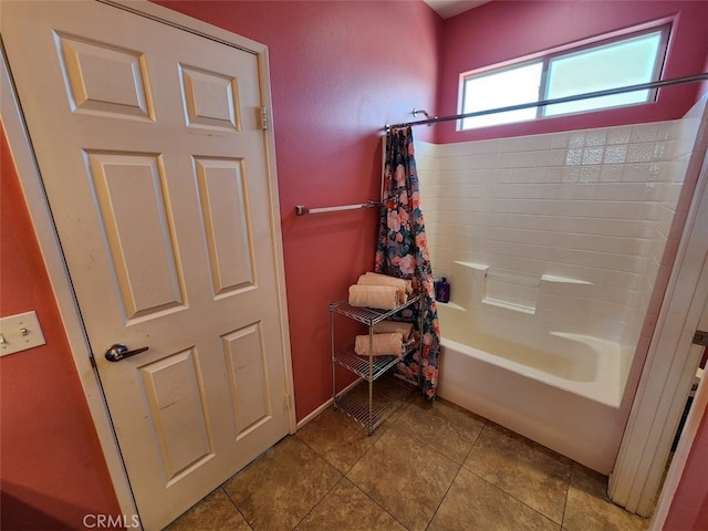 bathroom with shower / bath combination with curtain and tile patterned floors