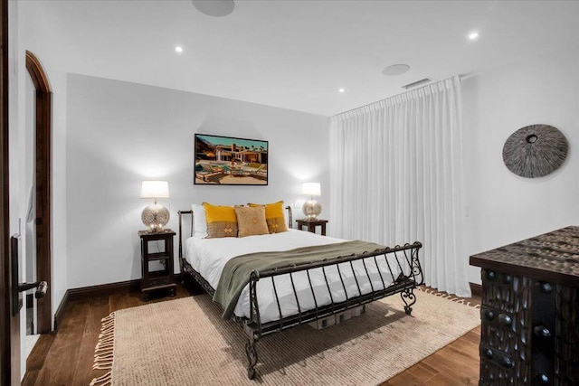 bedroom featuring dark hardwood / wood-style floors