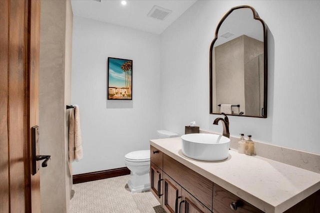 bathroom with vanity and toilet