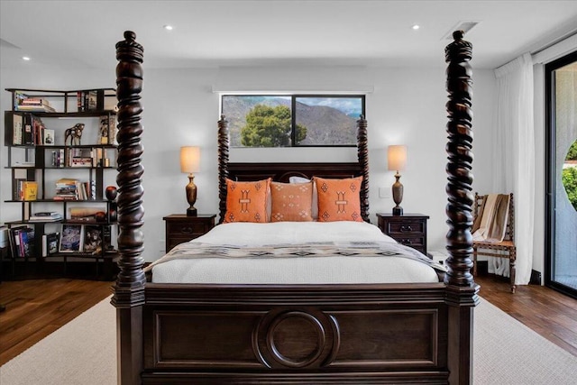 bedroom featuring dark hardwood / wood-style flooring