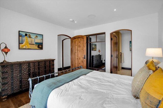 bedroom with hardwood / wood-style flooring