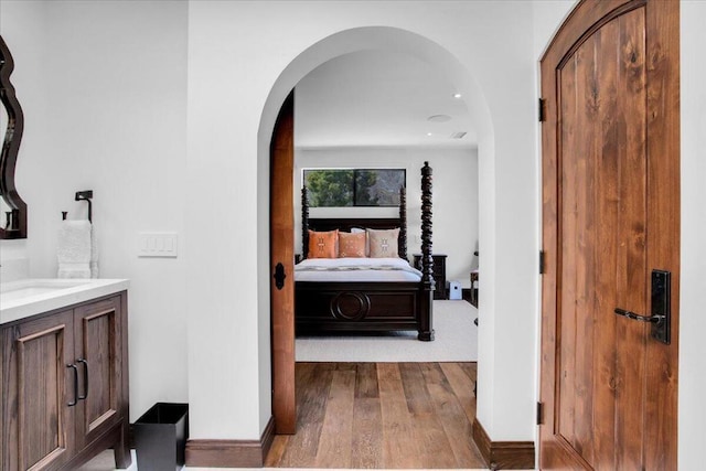 bathroom with vanity and hardwood / wood-style floors