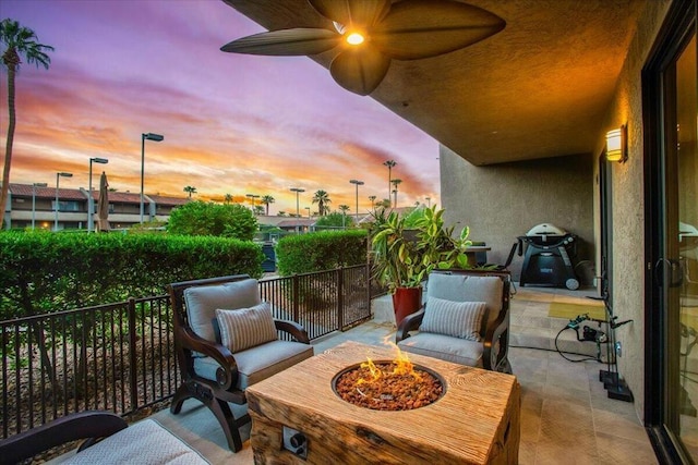 balcony at dusk with ceiling fan