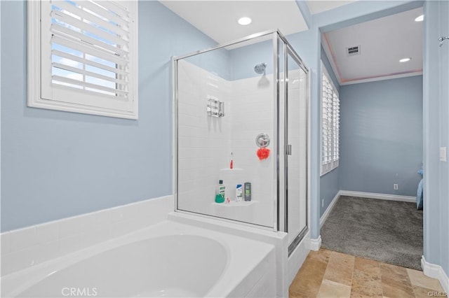 bathroom with shower with separate bathtub