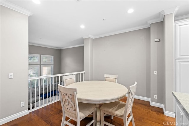 dining area with ornamental molding and wood-type flooring