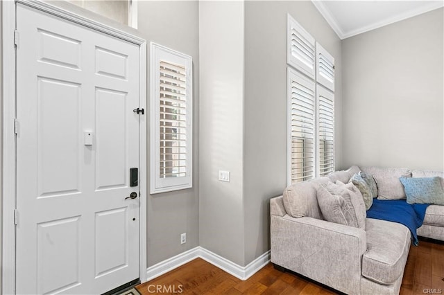 foyer entrance featuring crown molding and dark hardwood / wood-style flooring