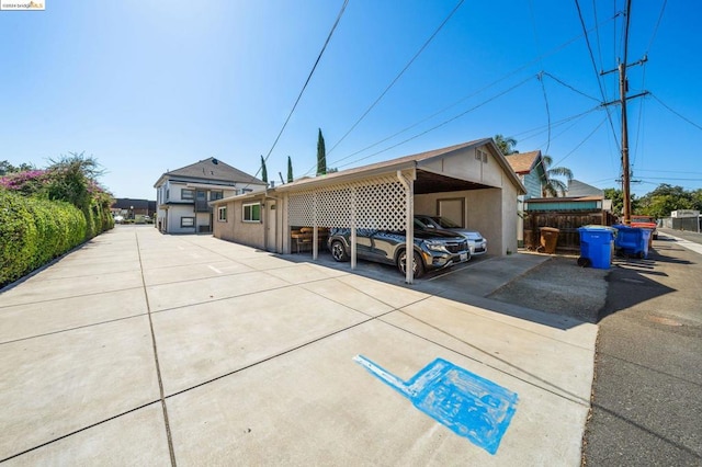 single story home featuring a carport