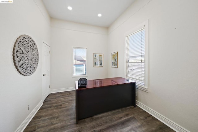 office space with dark wood-type flooring