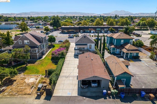 birds eye view of property with a mountain view