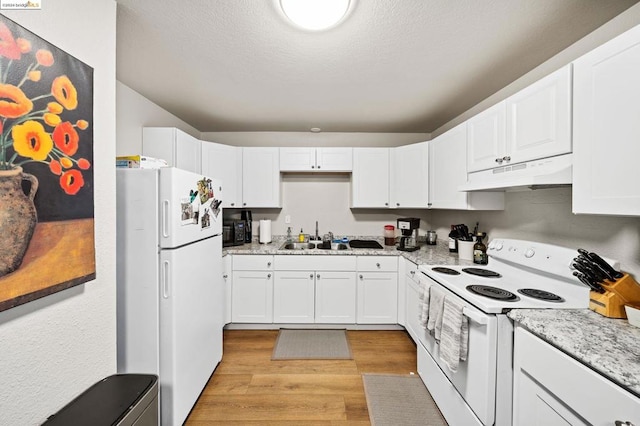 kitchen featuring light wood-type flooring, sink, white appliances, and white cabinetry