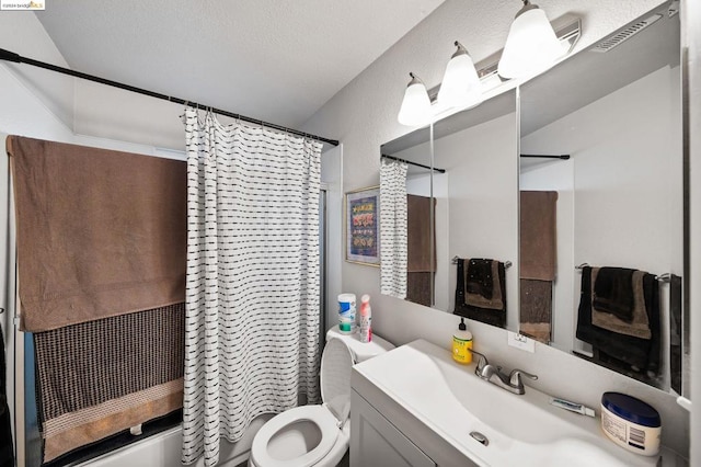 full bathroom with shower / bathtub combination with curtain, vanity, toilet, and a textured ceiling