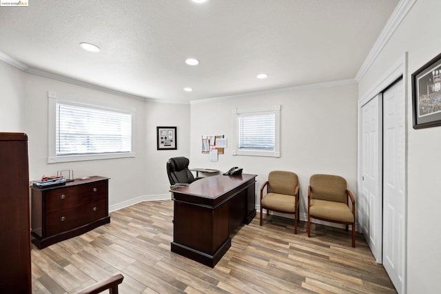 office with ornamental molding and light wood-type flooring