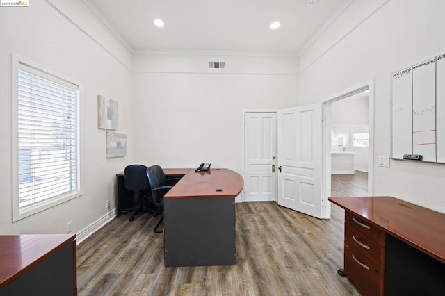 office area with plenty of natural light, crown molding, and wood-type flooring