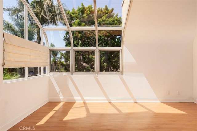 unfurnished sunroom featuring a wealth of natural light