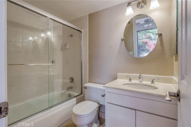 full bathroom featuring vanity, ceiling fan, toilet, and enclosed tub / shower combo