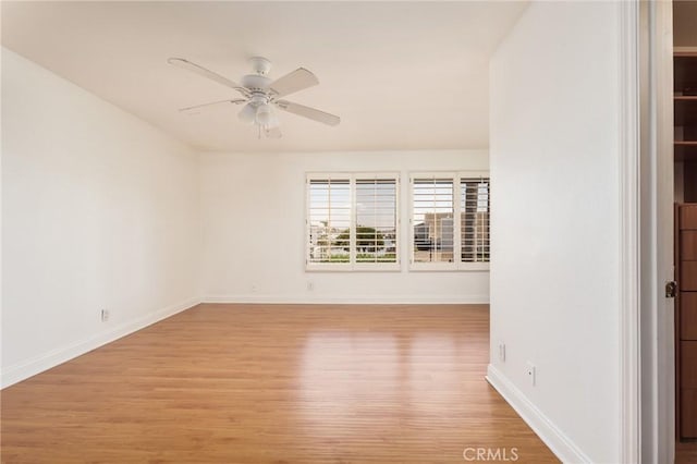 spare room with light hardwood / wood-style flooring and ceiling fan