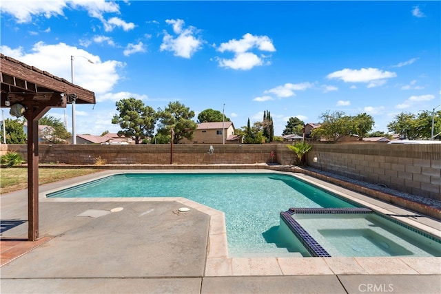 view of pool with an in ground hot tub