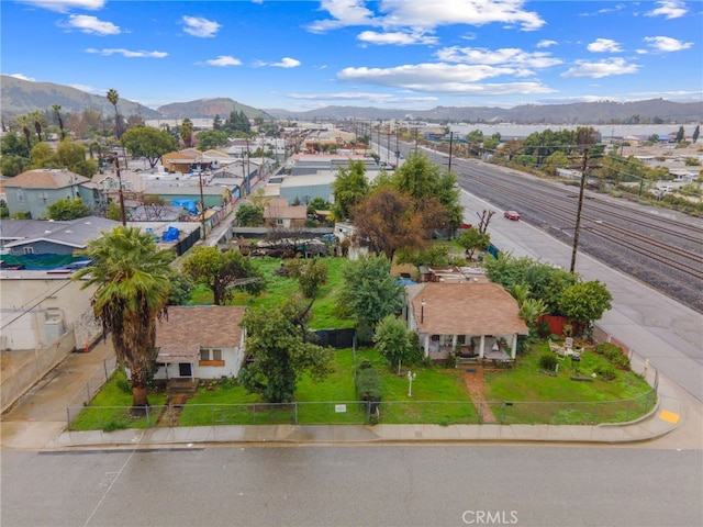 birds eye view of property with a mountain view