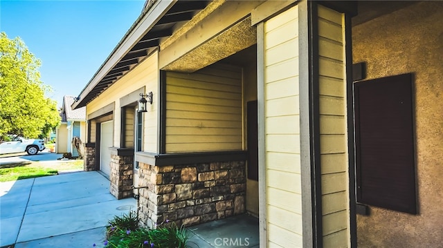 view of side of home featuring a garage