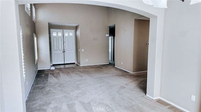 view of carpeted foyer entrance