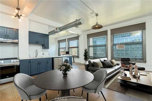 dining space with sink and light tile patterned floors