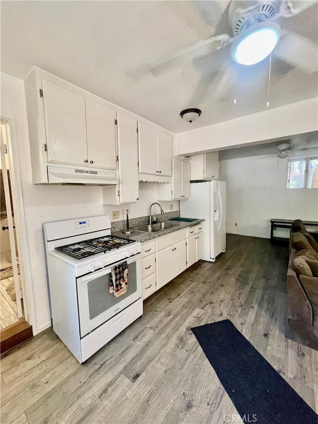 kitchen with white cabinetry, white appliances, sink, and light hardwood / wood-style flooring