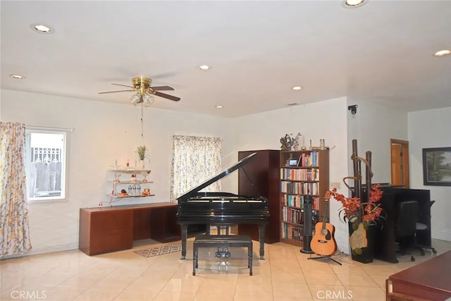 misc room with ceiling fan and light tile patterned floors