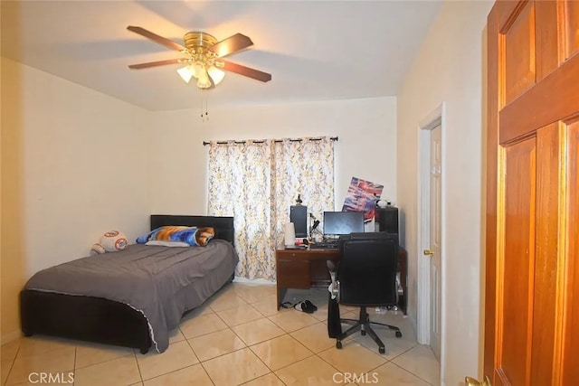 tiled bedroom with ceiling fan