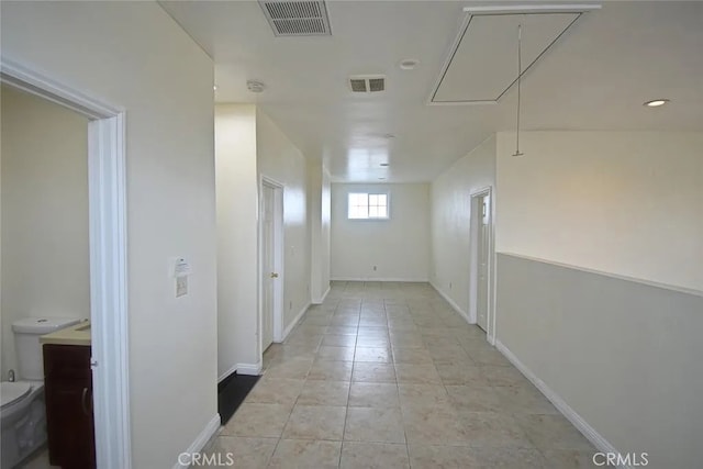 hallway with light tile patterned flooring