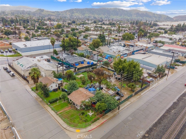 birds eye view of property with a mountain view